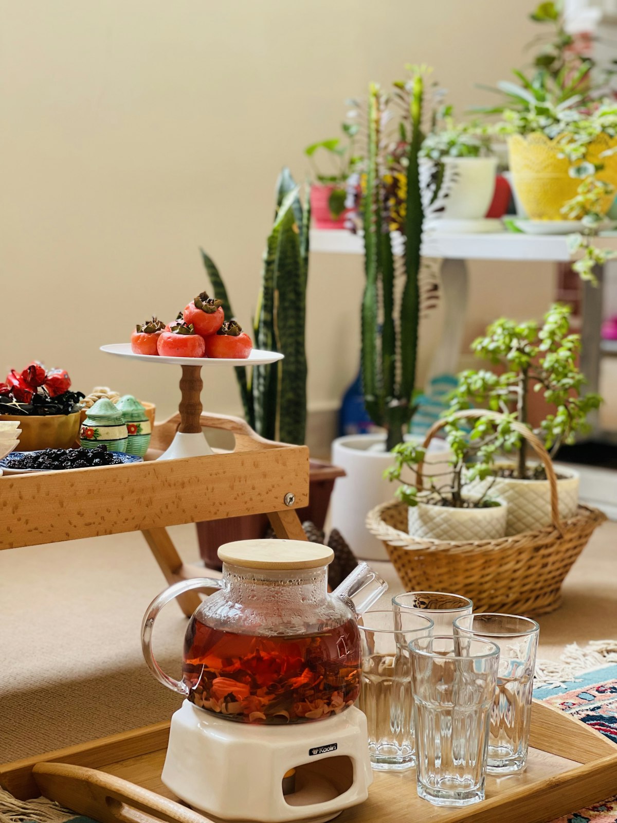 a tray with a tea pot and cups on it