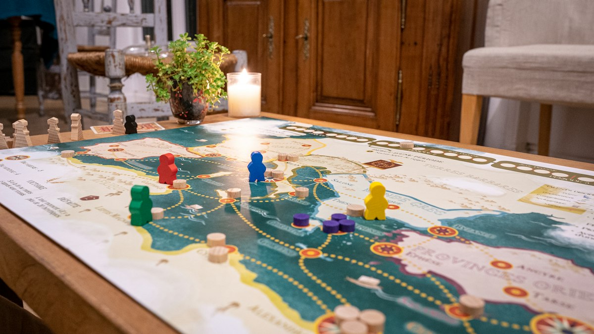 a table with a game board and game pieces on it