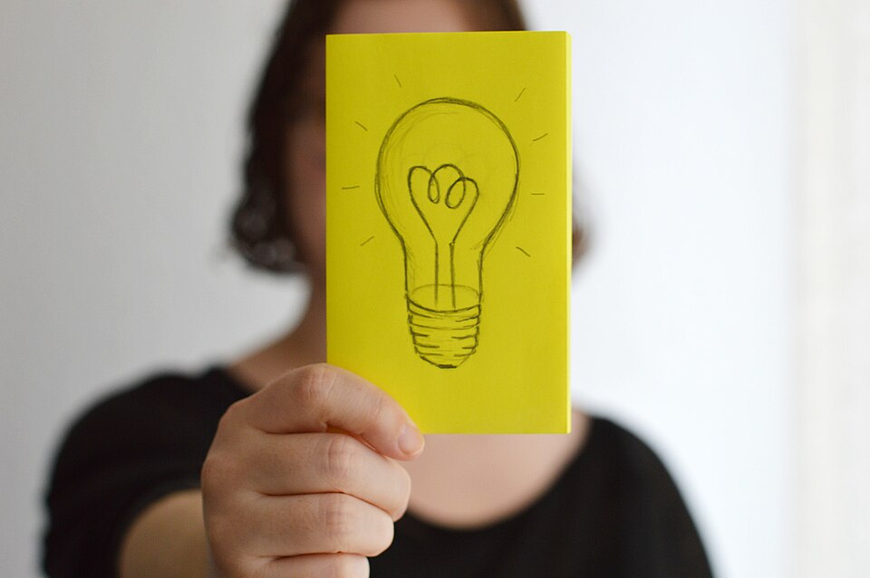 Sketch of a light bulb on sticky note