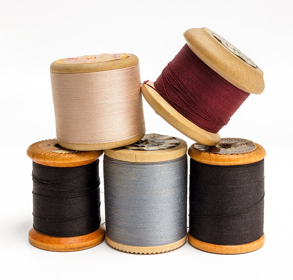 Wooden spools of sewing thread in different colors 6