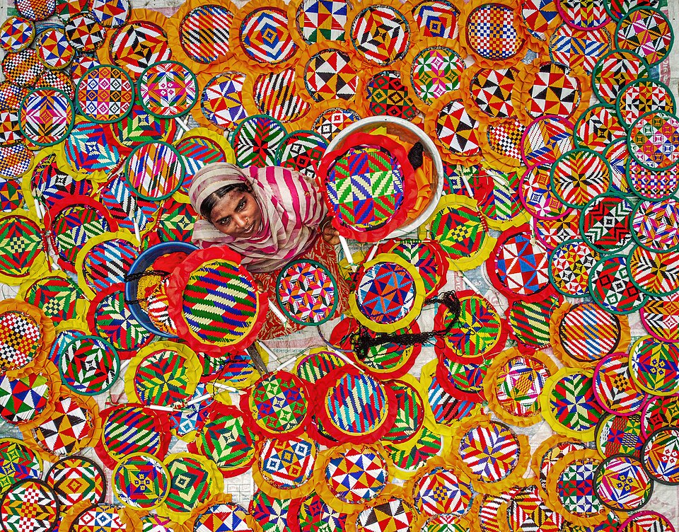 Woman sewing handfans