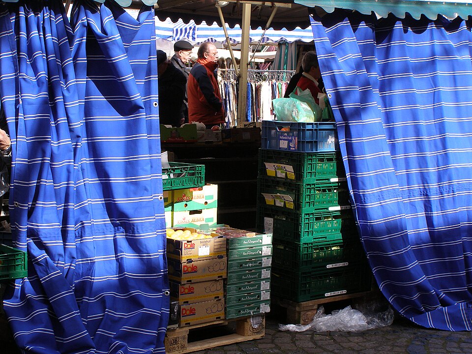 Blue curtains at market stall