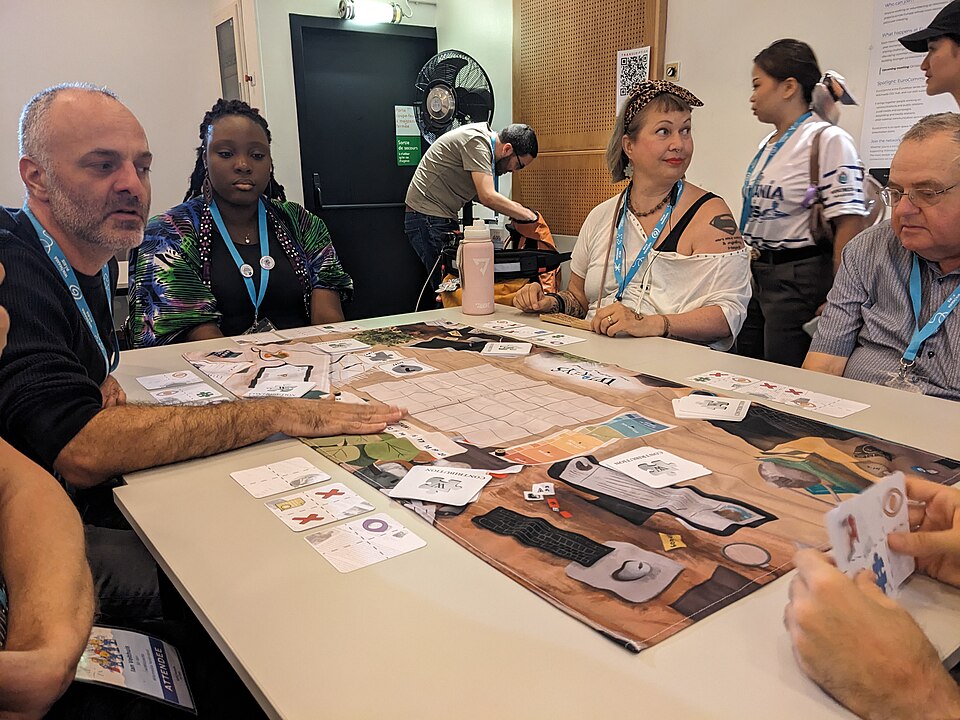 People starting to play board game during session 'Play Wikeys, the board game to discover Wikipedia' at Wikimania 2026, day 3