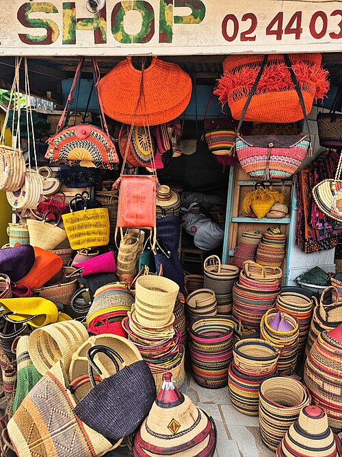 Woven baskets and bags market stall Ghana