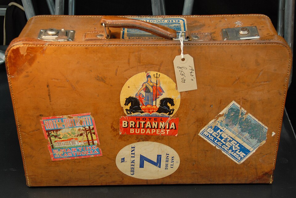 Suitcase with luggage labels (178491614)