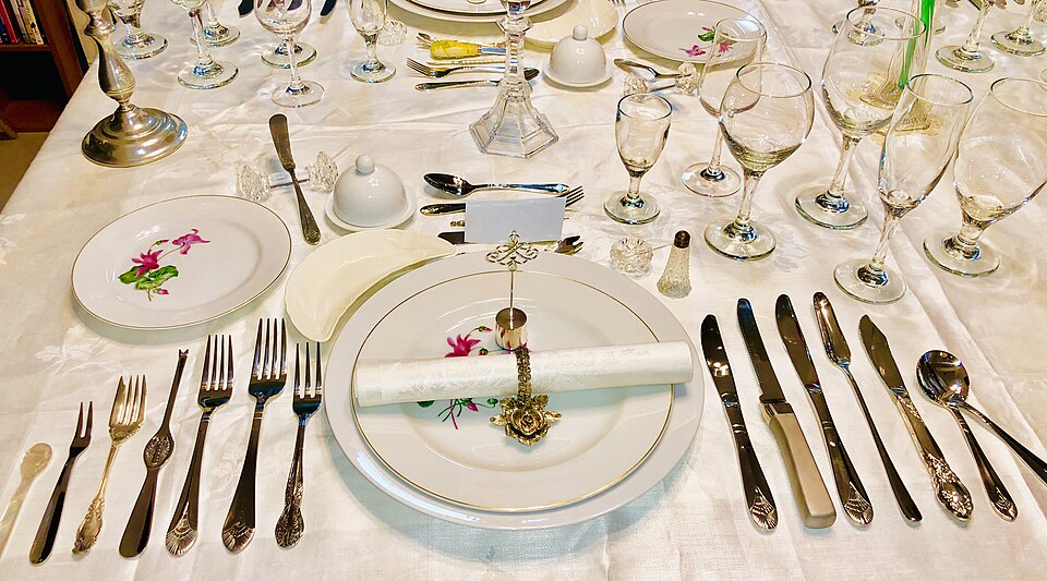 13 course table setting American angled view