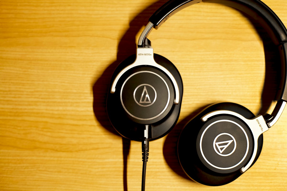 Over-ear headphones on a wooden surface